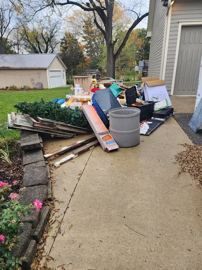Dumpster being loaded with debris for Roofing Dumpster Rental in Simi Valley